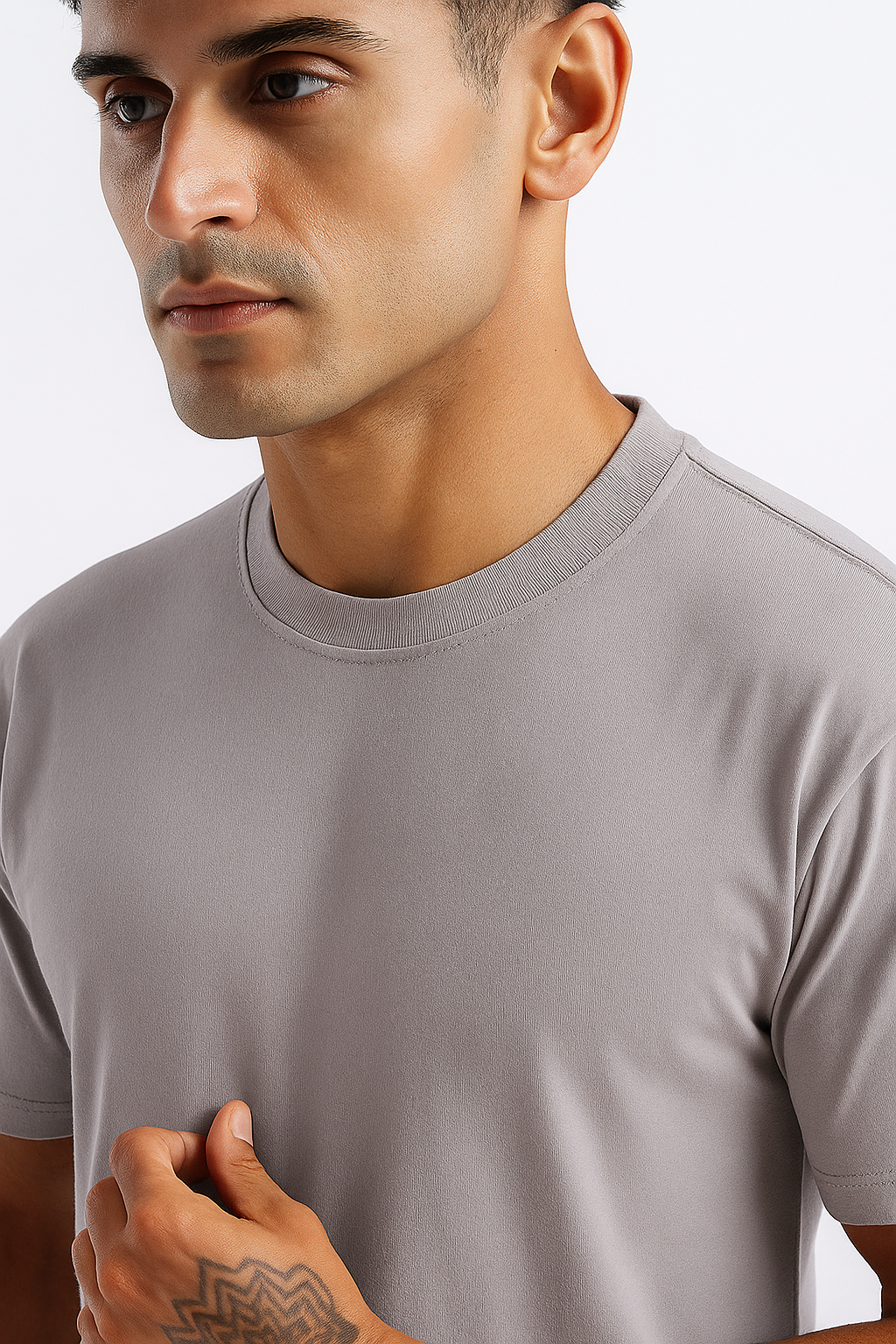 Detailed shot of the stitching on a grey men's t-shirt, highlighting the neckline.
