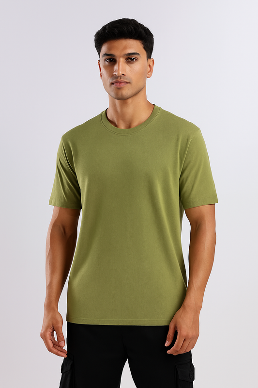 Man wearing a pista green ribbed ultra stretch T-shirt, shown from the front.