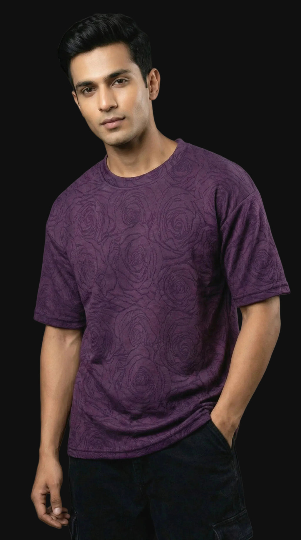 Man wearing a purple t-shirt against a black background