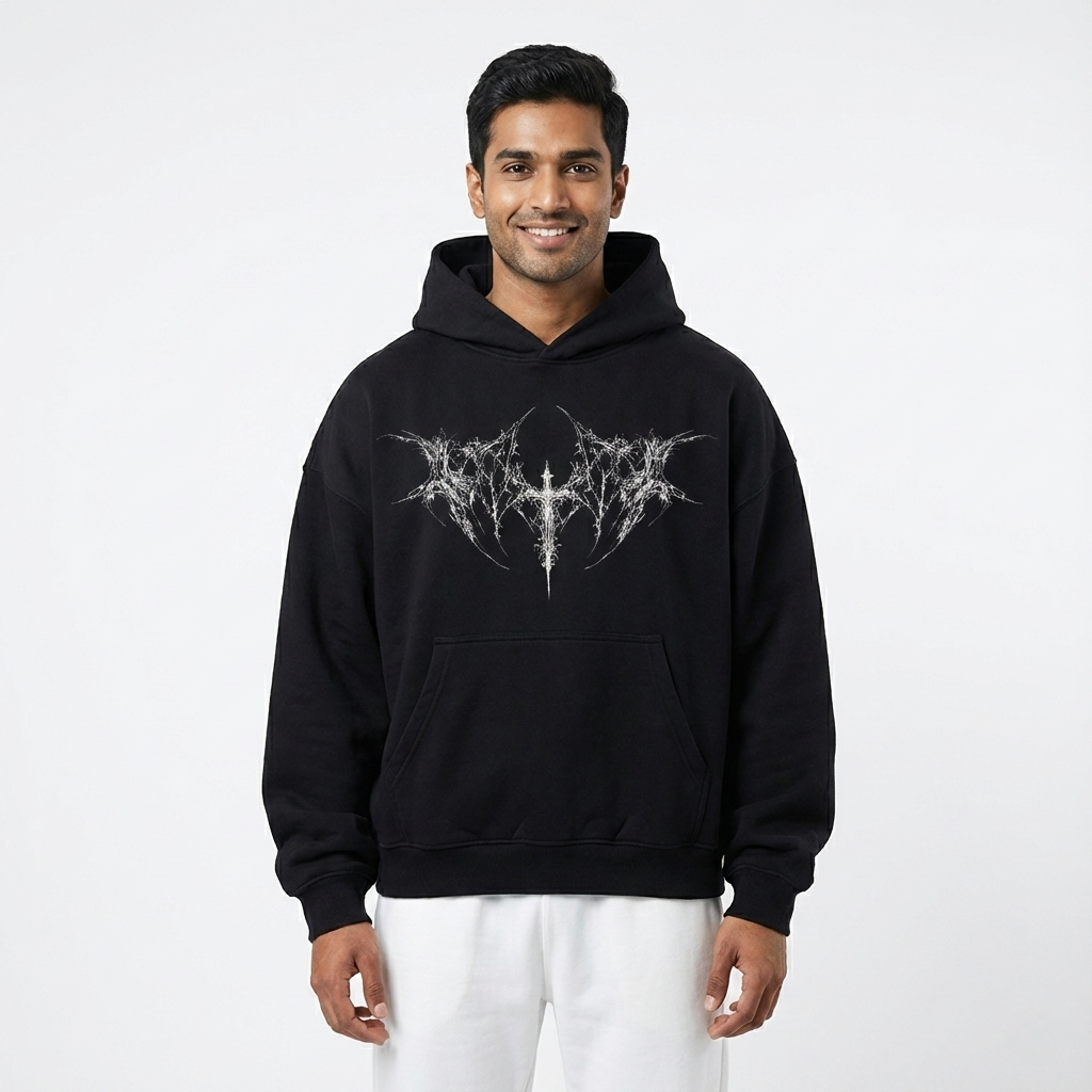 Man wearing a black hoodie with a white logo on a white background