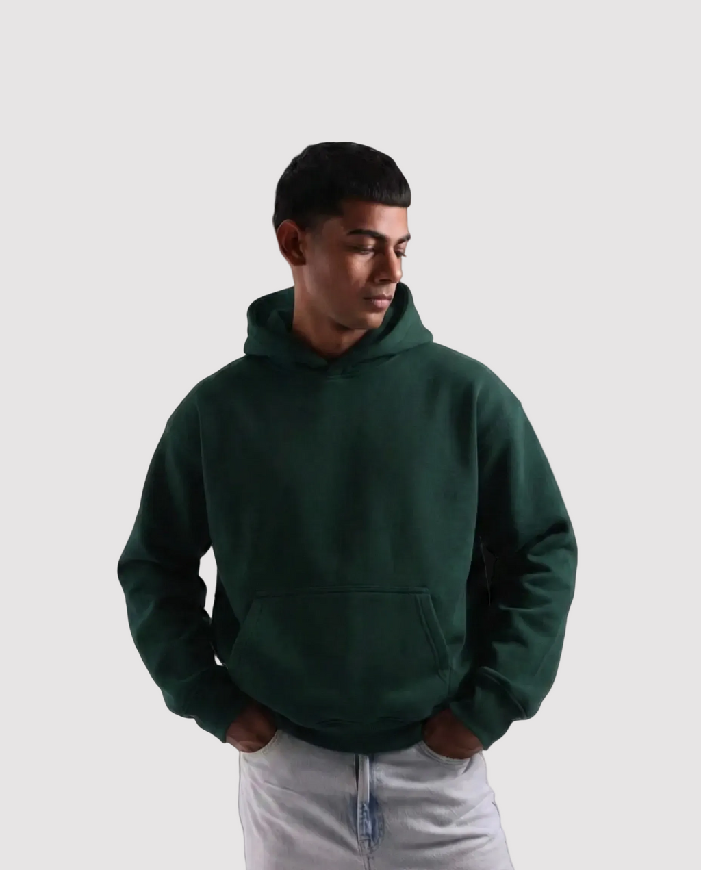 Person wearing a green hoodie on a white background
