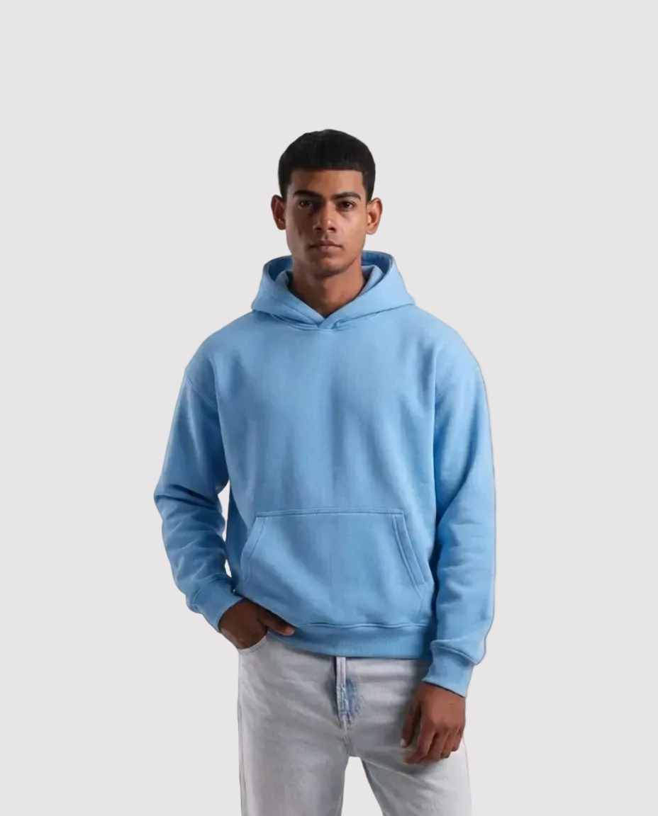 Person wearing a light blue hoodie on a white background