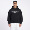 Man wearing a black hoodie with a white logo on a white background