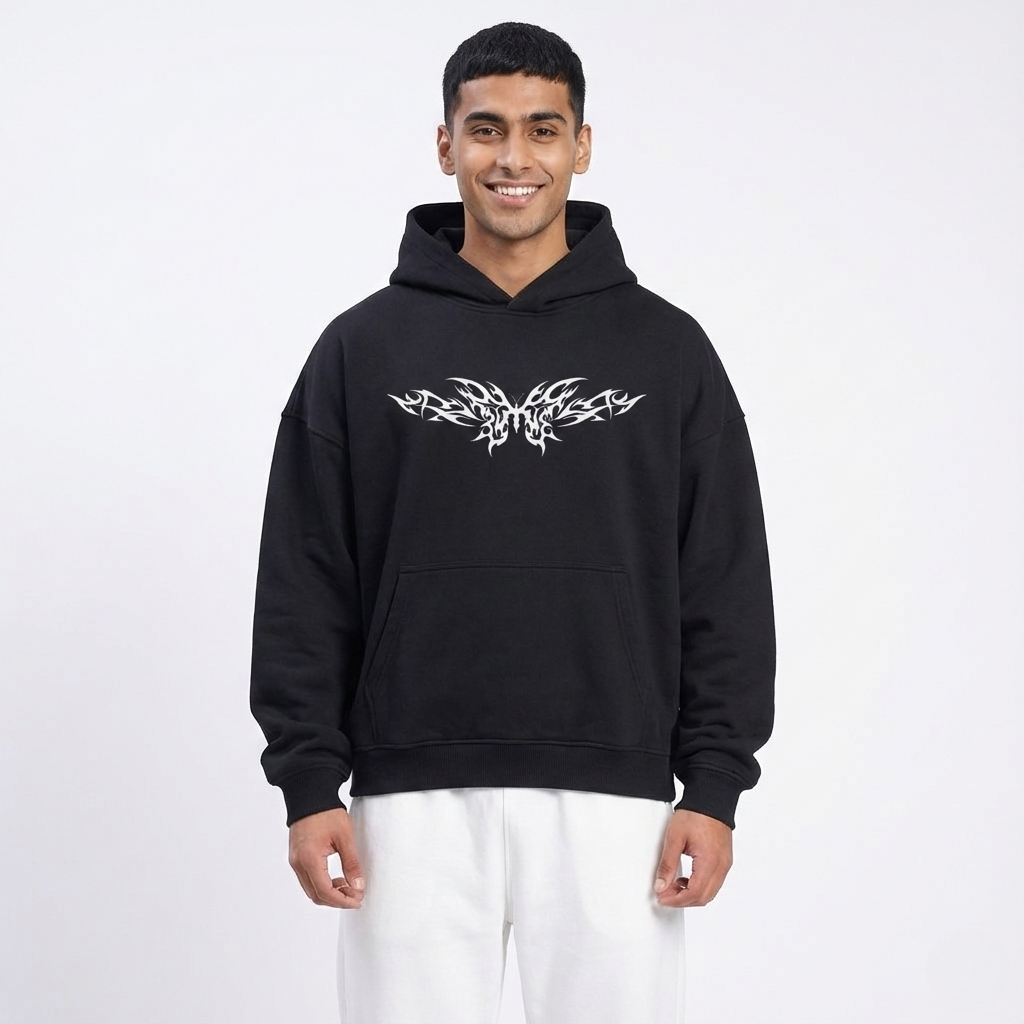 Man wearing a black hoodie with a white logo on a white background