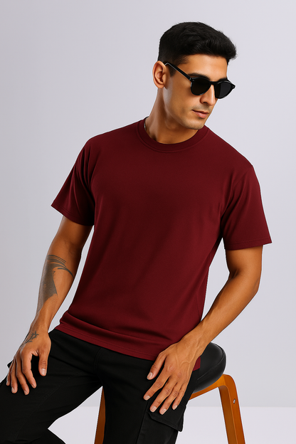 Model wearing Maroon Oversized T-Shirt in lifestyle setting – casual streetwear vibe