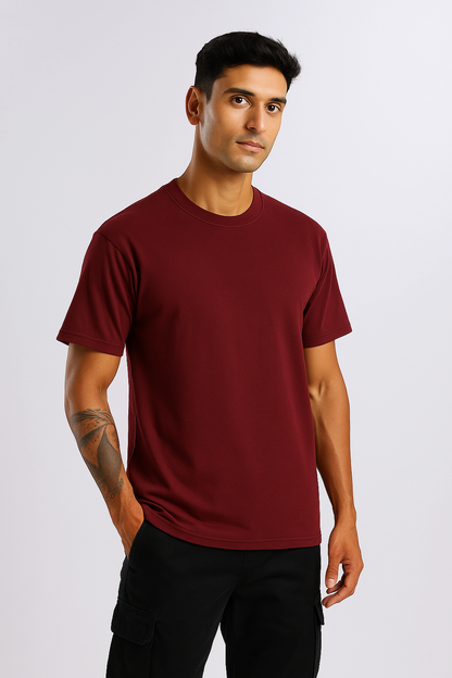Side profile of Maroon Oversized T-Shirt showcasing dropped shoulder and relaxed silhouette