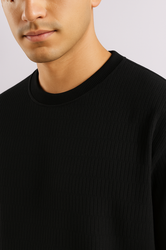 Close-up of a black ribbed oversized T-shirt highlighting the textured fabric and crew neckline.

These file names and ALT text follow SEO best practices and provide clear, accessible descriptions for your Shopify store.

Related
How can I craft an optimized image name for the textured oversized black T-shirt
What descriptive keywords should I include in the alt text for this ribbed T-shirt
How do I highlight the fabric texture and design details in the product images and descriptions
What specific features