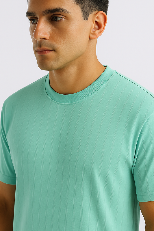 Close-up of a cyan ribbed oversized T-shirt highlighting the ribbed texture and crew neckline.