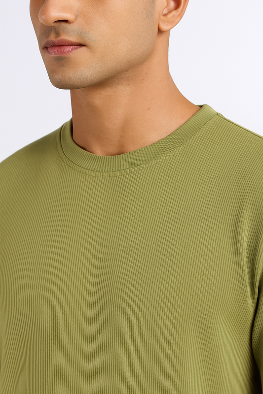 Close-up of a pista green ribbed ultra stretch T-shirt highlighting the ribbed texture and crew neckline.